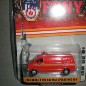 A miniature FDNY fire truck toy in packaging.