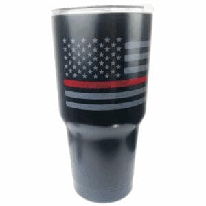 A black tumbler with a faded American flag and a red line.