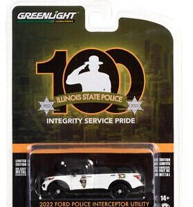 Die-cast model of a vintage police car in packaging.